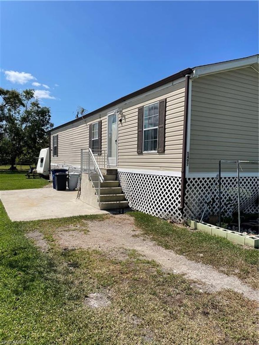 Live on Pine Island for under 150K. 2 bedroom 1 bath manufactured home on fenced lot. Property is being sold AS IS with right to inspect. In addition to the Manufactured Home there is a wood frame out building.  The home is being sold partially furnished a list of items that do not convey is attached.