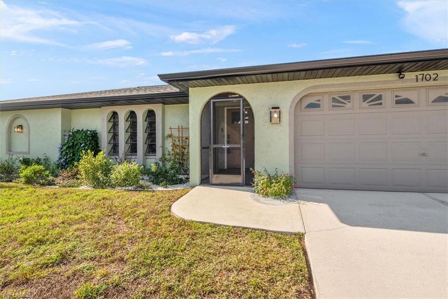MOTIVATED SELLERS! Completely Remodeled Better-Than-New Pool Home in SE Cape Coral! Welcome home to this beautifully renovated 3 bedroom, 2 bathroom heated pool home perfectly situated in the highly desired South East Cape Coral area—just minutes from shopping, dining, entertainment, and everyday conveniences. With all assessments paid, a fenced backyard, and a long list of major upgrades, this property offers the ultimate move-in-ready experience. Step inside to a bright, modern interior showcasing quality finishes throughout. The open-concept layout flows effortlessly from the living area to the redesigned kitchen and out to your private screened-in pool—ideal for relaxing or entertaining and features a new pool deck with LED perimeter lighting. Enjoy peace of mind with big-ticket improvements already done, including a newer roof, soffit, facet and gutters, A/C, and water heater. The exterior is just as impressive, with a fully fenced yard perfect for pets, gatherings, or simply enjoying the Florida sunshine. Best of all—this home is not in a flood zone, NO FLOOD INSURANCE REQUIRED and features an assumable 3% mortgage, offering an incredible opportunity to secure one of the lowest interest rates available today! Don’t miss your chance to own this stunning, better-than-new pool home—schedule your private showing today!
