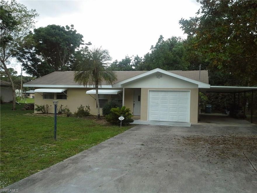 This adorable 1198 sq. ft. home features 2 large bedrooms, 2 full bathrooms, 1 car garage, spacious carport, screened and tiled back porch, completely renovated kitchen with white lacquered wood cabinets, new appliances, wood grain porcelain tile though out, new A/C, shutters, alarm system and city water. The house sits on a half acre lot with lots of room for a pool. Nestled in a lush foliage of mature tropical fruit trees, this well maintained property is located in a very private setting yet