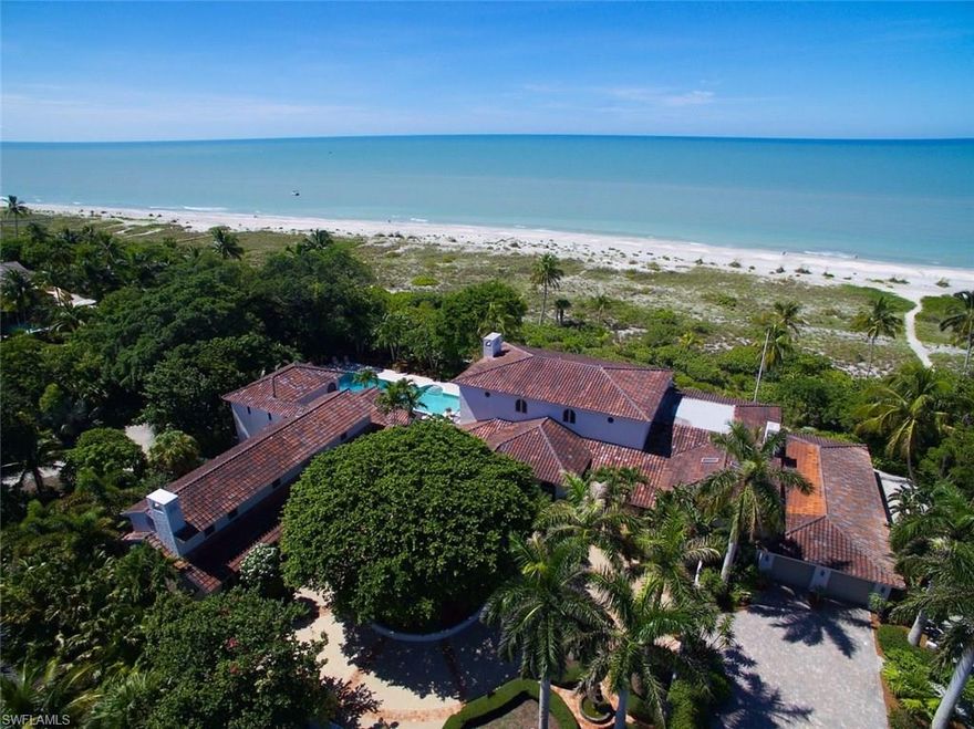 A spectacular trophy compound setting on over 4 acres w/315 ft of unspoiled beach frontage.The Property sits on 3 single beach front lots with the ability to subdivide if ever desired.This sprawling,"Old World Mediterranean Style" Estate was totally remodeled in yr 2000 and features 6 bdrms of true comfort all the while being surrounded by unprecedented natural beauty.Grand in every detail and perfectly scaled,this estate offers private guest retreats,spacious informal & formal gathering areas,sweeping lanais that capture endless sunset views, guest house,4 fireplaces,marble flooring,hi tech elect and security system,covered porte-cochere,incredible pool &tennis areas & more.
