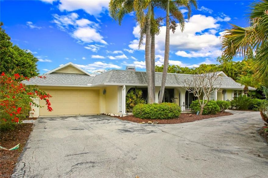 REDUCED ANOTHER $25,000 - Directly across from BEACH ACCESS #1, in a highly sought after location, this rare ground level home is now available with over 3,100 sqft of living space, 4 beds, 3 baths, including a separate 37’ X 12’ pool cabana. You will be amazed when you walk in the stone lined foyer leading to your enormous open living space that flows right into the nearly 50’ screened in pool deck. Front living space offers stone fireplace, 12’ of sliding glass doors, with endless possibilities. Saturnia Marble floors expand from the front entry throughout living areas.With an open concept kitchen this 1966 home was ahead of its time. Oversize pool deck has imported Turkish Marble stretching to the pool cabana. A lush tropical oasis on 0.59 acres of privacy. Oversize 2 car garage gives you additional storage. Bonus room off kitchen could be used as fourth bathroom or butlers pantry. Current code prohibits construction of circular driveway and separate living structures,this compound is truly one of a kind!