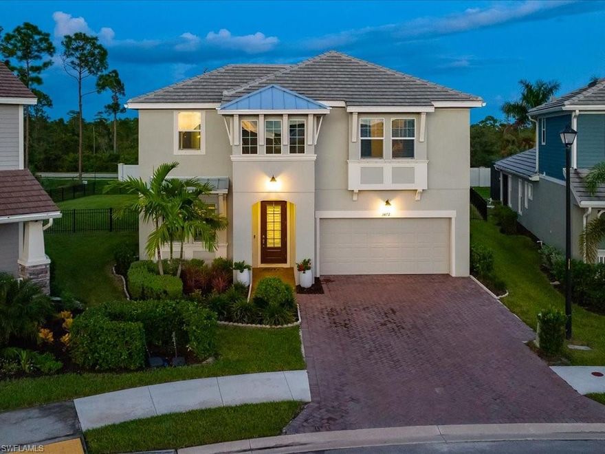 Stunning Coastal Contemporary home on one of the largest lots in Compass Landing features an extensive fenced yard.  The screened pool and spa and spacious covered area offer outdoor entertaining options for family and friends.  This Commodore boasts an open floor plan with the master bedroom on the first floor. The top-of-the-line Gourmet Kitchen features upgraded hood and Kitchenaid appliances including two ovens and a custom built-in Kitchenaid refrigerator.  Custom feature walls in the entry, great room and master bedroom, add designer touches.  Crown molding, recessed lighting throughout, plantation shutters, tray ceiling in the master and sliding glass doors from the master to the lanai are just a few of the upgrades of this stylish home. The flex room/ loft is a wonderful space for recreation regardless of age.   All of the bedrooms are ensuite.  Located in North Naples, Compass Landing is located in a very desirable school system, close to daycare and preschool options and only a few minutes from countless shops, restaurants and other amenities.
