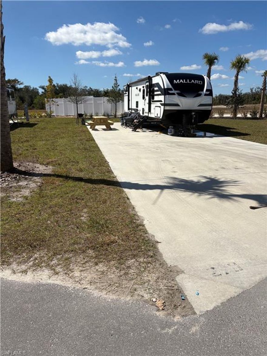 Exceptional opportunity to acquire two oversized Perimeter RV sites within Palm Breeze RV Resort, offered together as a package sale. These separately parceled sites are located in close proximity along the resort’s outer boundary, providing enhanced privacy, added green space views, and a quieter setting away from interior traffic corridors.

With expanded dimensions beyond the standard footprint, these oversized sites offer outstanding flexibility for future development and customization. One site could accommodate a beautiful park model (subject to resort guidelines and approvals), while the second site provides the ideal canvas for a dedicated outdoor entertainment space — envision a tiki hut, outdoor kitchen, extended paver patio, fire feature, or gathering area designed for relaxed Southwest Florida living.

Each site includes a concrete pad with 50/30/20-amp power pedestal and water connection, allowing for immediate use while you plan your long-term vision.

This dual-site package offers unique versatility — perfect for those seeking a private residential retreat paired with an expanded outdoor entertaining environment, multi-coach flexibility, or a strategic investment opportunity with future resale options.

Parcels are separated by an internal resort roadway and are being sold together as one package. Each parcel carries its own folio number, tax bill, and HOA assessment.

Palm Breeze offers resort-style amenities including a clubhouse, pool and spa, fitness center, pickle-ball courts, and a vibrant social calendar — all located in Punta Gorda, just minutes from waterfront dining, shopping, golf, and Gulf Coast beaches.