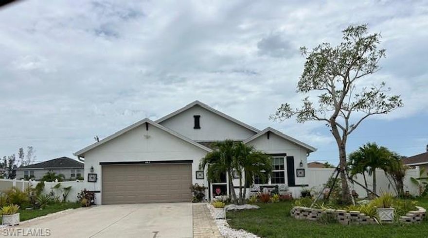 Spacious 4 bedroom 2 bath 2 car garage single family home. Fenced back yard with plenty of room for a pool. All assessments paid, not in flood zone. Located near shopping and just a short distance from Fort Myers and Sanibel beaches.