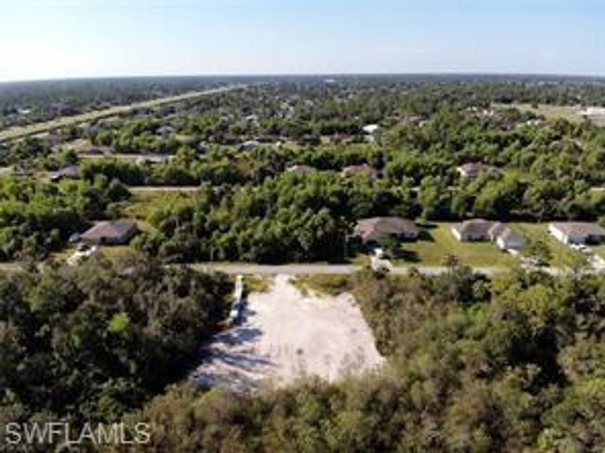 This Cleared and filled 1/4 Acre piece of land is a diamond in the rough. No neighbors behind you as it
backs up to a green space. 16 miles to RSW airport, close in to town