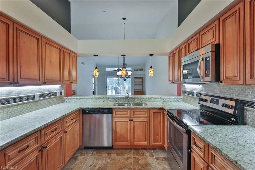 Much sought-after SECOND FLOOR condo in the Villages of Kelly Greens Golf & Country Club, 2 bedrooms plus a den, 2 bathrooms, cathedral ceilings, brand new AC, electric storm shutters, lanais front and back, updated appliances, solid surface counters in kitchen & baths, brand new wood floors and carpeting, updated lighting. Each unit has a single-car garage with an extra parking pad in driveway - guest parking also available. Large heated swimming pool steps away from the unit. You have a GOLF COURSE VIEW BUT NO GOLF COURSE DUES -
 which means a new buyer DOES NOT pay the $5000 upfront membership fee or the Master Association dues. Kelly Greens Golf & Country Club is only a few miles to Sanibel and Captiva islands, and only a few minutes to Bunche Beach & Fort Myers Beach. Near fine dining, shopping centers, boating, fishing, Healthpark Hospital and FGCU.  Only a short drive to the Southwest Florida International Airport, the Red Sox and Twins spring training stadiums.