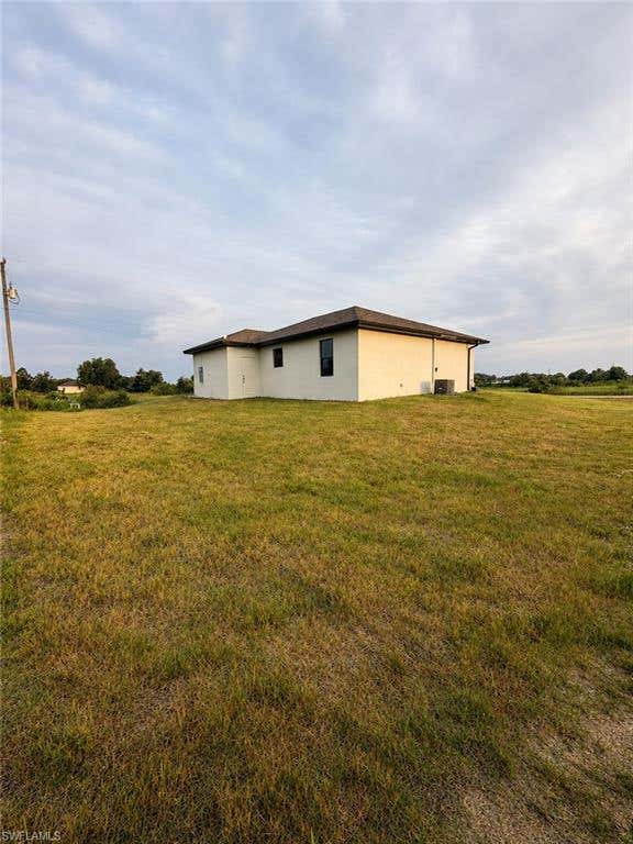 Photo of 4104 E 17th ST, LEHIGH ACRES, FL 33972 (MLS # 226026954)