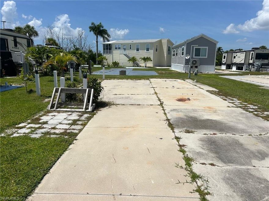 Welcome to Palmetto Palms RV Resort and Condominium Association where YOU own the land! Located on C St., and a short walk to the clubhouse and one of two swimming pools, tennis courts, and shuffleboard, makes this location fantastic. A short walk to pickle ball, horse shoes, and volley ball courts, and even a second pool! This lot can accommodate a new manufactured home, RV, camper, or 5th wheel. Just 1 mile from Bunche Beach and 4 miles from Times Square Fort Myers Beach! Water, power, sewer, and Internet are all currently available in the park.  Grab a little piece of the sunshine state while you still can. Non pet section of a 55+ community. Welcome to your new paradise, where summer never ends.