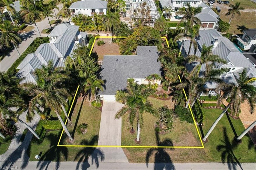 A unique opportunity to build your dream home on this rare, oversized lot in the heart of downtown Naples. Walk down this quiet, palm tree lined street to the beach, 3rd Street shopping /entertainment and the Naples Yacht Club. The expansive 106' wide X 150' deep building lot allows you to build a larger than average home to your exacting specifications and taste so you can make it the perfect private retreat for you and your family. While the house is perfectly livable you could "land bank" it and build later while renting it out for income. Others may consider it a tear down.

In addition to the ultra convenient yet private location you will have plenty of room for a pool, backyard activities, and a custom, lush garden. The current home on this raised lot had no water intrusion in the past few storms.