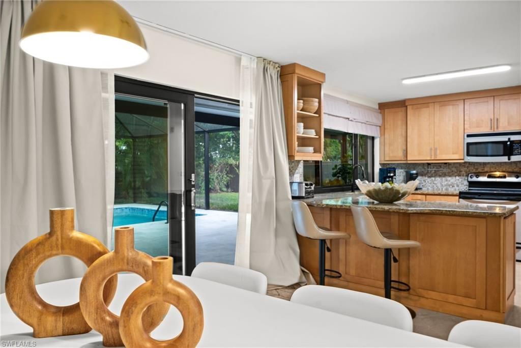 Photo of 472 Palm River BLVD, NAPLES, FL 34110 (MLS # 225077771)