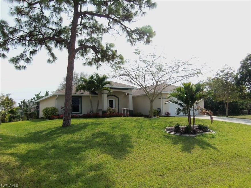 Located In One Of The Most Desirable Locations Of Southwest Cape You Will Find This Well Maintained 3 Bedroom 2 Bath Home Surrounded By Mature Trees ,Palms,Shrubby,And Color-Filled Plants. Freshly Painted Walls And New Laminate Flooring In The Living Room And New Carpeting In The Bedrooms And Walk-In Closets.Great Bright Open Floor Plan Features A Kitchen That Over Looks The Great Room And Dinning Area. Features Large Sliders Opening To A Lanai And Yard With Mature Landscaping For Privacy.A Large Shed For Storage.All This And No Flood Insurance Needed.City Water/Sewer. Furnishings Negotiable. Convenient Location Close To Shopping, Restaurants, Beaches And More.