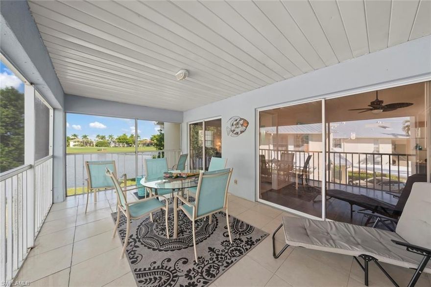 SUNLIGHT POURS IN OFF THE GLISTENING LAKE. Second floor end unit with windows seemingly everywhere. Located in the Rivers Edge Community of prestigious Gulf Harbour Golf and Country Club in Southwest Ft. Myers. The living room, kitchen and primary bedroom are wrapped around the huge screened lanai with the sliding doors forming a corner of glass that allows the spectacular water view to sparkle through virtually the entire unit. Vaulted ceilings increase the open feeling. Laminate flooring thru the living area with Berber carpet in the bedrooms. Updated kitchen with granite countertops and lazy susan lower units.  Primary bedroom accommodates a king bed plus supporting furnishings. Large walk-in closets. Updated bath.  Large closets in both guest bedrooms, one with a conventional bedroom set and the other with bunk beds and pull-out trundle.  Stacked washer and dryer with utility closet adjacent to bedrooms. Updated guest bath. Dining area overlooks water view. Covered reserved parking. Guest parking nearby.  Just a few steps to the community pool and spa.  Sold completely turnkey with classic comfortable furnishings so it is move-in ready, either as a winter hideaway or great seasonal rental. Miles of pathways inside the gate to enjoy bike rides, jogging or casual walks in the sunshine.  Close to Ft. Myers Beach, Sanibel Beach and nearby Bunche Beach. Or simply stroll the private Gulf Harbour Eagle Perch Island for gorgeous sunsets. Surrounded by shopping and restaurants. Easy access to SWFL International Airport, plus Twins and Red Sox baseball stadiums. Additional amenities of golf, tennis, fitness center and two restaurants require an optional membership, now available at a surprisingly low fee.