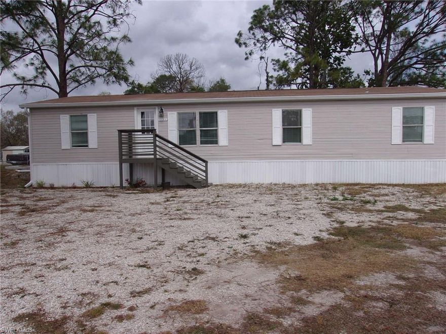 Never lived in beautiful new manufactured home with lots of upgrades.  Many new features. Sit on the large deck in front of the home. Very convenient to the interstate and downtown Ft. Myers.