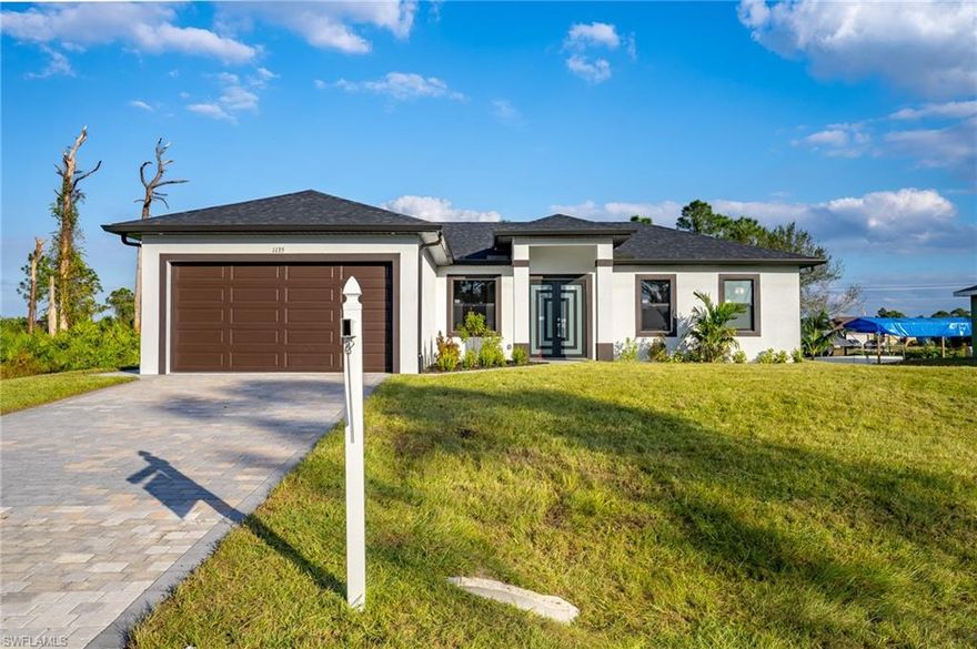 Welcome to this Beautiful New Construction in the most calm area of Lehigh Acres, conveniently close to road 80 for easy access and exit, it counts with all sorts of features like automatic garage doors, LED lights for energy efficient, tile floors trough out the whole house, modern kitchen with built in microwave and much more. Make your appointments now before its too late.