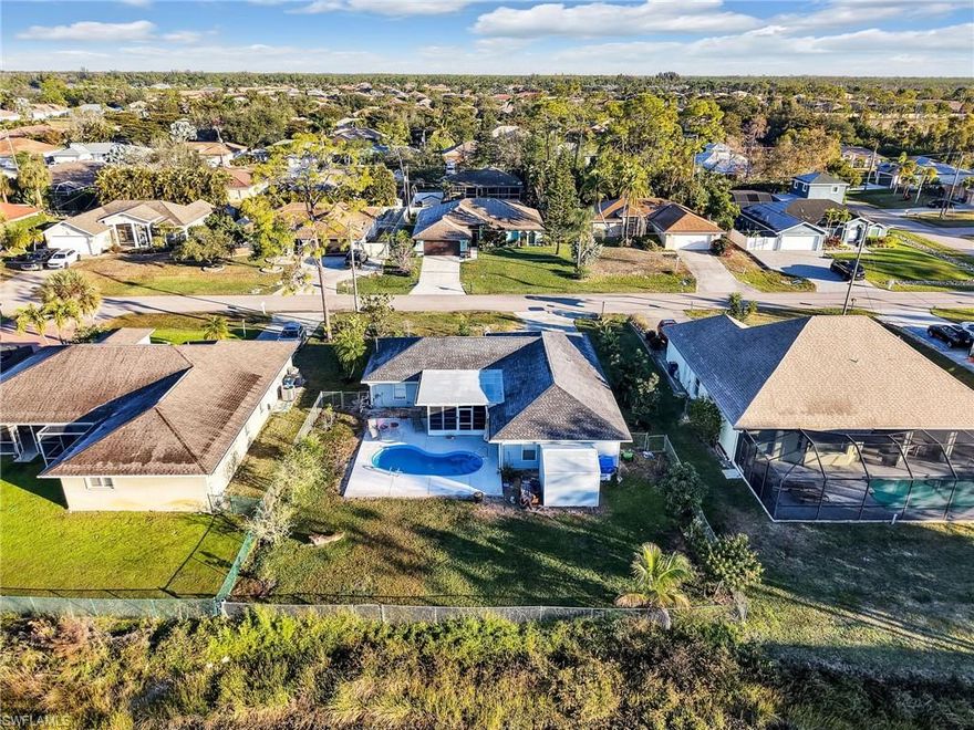 NO HOA'S! BEAUTIFUL POOL HOME! Step into a magnificent chef’s kitchen designed to impress, featuring an oversized island that invites you to gather, relax, and savor everything this home has to offer. With a new roof (2023), beautifully updated kitchen upgrades—including a brand-new Wi-Fi–enabled double oven and induction cooktop—and a sparkling pool with a concrete deck (new in 2026), this home is perfectly suited for entertaining, embracing beach-town living, and enjoying everyday life.
The thoughtfully designed layout offers three bedrooms, two bathrooms, ample space for a home office, and convenient lanai access from both the dining area and guest bath—ideal for seamless indoor-outdoor living.
Outside, you’ll find a lush collection of mature fruit trees, including avocado, banana, mulberry, soursop, mango, figs, lychee, and a variety of citrus—even pink lemons—creating your own private tropical retreat.
Lovingly maintained, this home radiates warmth and an inviting charm you’ll feel the moment you arrive.