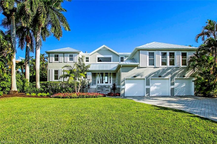 5,000+sq.ft. of air-conditioned living space, on deep bay-front parcel w/ bayside porch & pool. New metal roof, paint, closable front impact shutters, landscaping, & entry/landing, matching those at renovated pool. Reconfigured bay porch w/retractable screens. Spacious 3-car garage w/4-stop elevator. Central great rm w/soaring ceilings, gas fireplace, French doors & new upper windows. New 1st level master suite provides easy access for buyer wanting 1-level living w/guest rooms above. Also 1st level, 2nd bedroom w/full bath & huge kitchen/ w/2nd gas fireplace, spacious island, breakfast bar & butler's pantry. Kitchen has 2 new Subzeros, 2 dishwashers, & Wolf gas range. Huge media rm over garage w/mini-kitchen & half bath. Top floor has 2nd master suite, 4th bedroom w/cedar closet, bayview office w/full bath, many built-ins, & large open deck. Wood floors refinished, new carpet, paint, & 4 flat-screen TVs. Includes Lot "O" in boat basin w/dock & lift (4th from left facing basin).