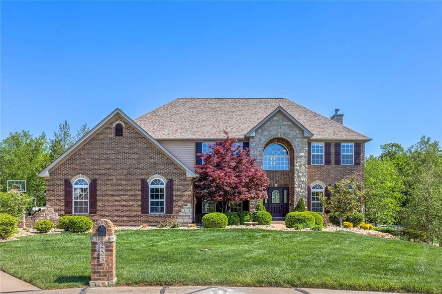 Welcome to your dream home, with 5200 sq ft total living space, in highly sought after Cottleville. This custom built, 5 bedroom, 4.5 bath home is nestled on a gorgeous 1 acre lot . An inviting two-story entry opens to a large formal dining room with trayed ceilings and a living room with custom bookshelves and French doors. The spacious eat-in kitchen has an oversized center island, 42" cabinetry, granite countertops, stainless steel appliances and large walk-in pantry. Upstairs the large primary suite offers coffered ceilings, a custom 12x13 walk-in closet with center island, and en suite bath. Bonus room with custom bookshelves and three spacious bedrooms each with walk-in closets complete the upstairs.  2 bedrooms share a Jack-and-Jill bath. The finished walk-out lower level is perfect for your entertaining needs. You will find a full custom bar, work-out room, 5th bedroom and 4th bath. Escape to the privacy of the picturesque backyard and enjoy the custom designed salt water pool.