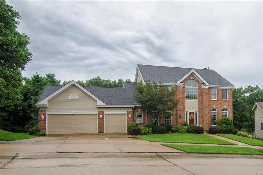 WOW! So much for so little! This spacious family home 'checks all of the boxes'! Huge kitchen, breakfast rm w/center isle & breakfast bar, granite counter tops, planing desk, ceramic floor, vaulted ceiling & is wide open to the Family Rm w/brick FRPL & BI Bookcases, floor-to-ceiling windows + transoms! 2 STY foyer w/dramatic starburst transom window & flanked by Living & Dining rooms w/half round transoms too! Large cedar deck, backing to towering trees & stairs to grassy yard + lovely landscaping: Finished W/O Lower Level w/huge Rec Rm, BI TV, bar with under counter fridge, BI bookcases, 5th bedroom, full bath & bonus rm! Master suite w/cathedral ceiling, WI closet & luxury bath w/tub & separate shower, ceramic floor, vaulted ceiling: Six panel wood doors: Plus, many updates, newer HVAC, hot water heater, dishwasher, carpeting, Roof & Vinyl Siding & much more! One Year Home Warranty.