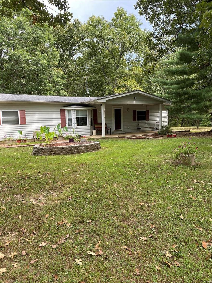 Here is your opportunity to purchase over 16 beautiful, wooded acres just around the corner from Brown's Ford Big River Access.  The property comes with a 3 bedroom 2 full bath manufactured home, oversize laundry room, and completely enclosed HUGE back porch, perfect for entertaining, or just relaxing and enjoying your privacy while watching the wildlife come right up into your back yard. Both covered car ports are staying with the property, but some of the sheds are not included.  
This home is an "AS IS" transaction.  Seller is not to be presented with an inspection notice.  Professional photos with aerial views of the property on 9.03.21.