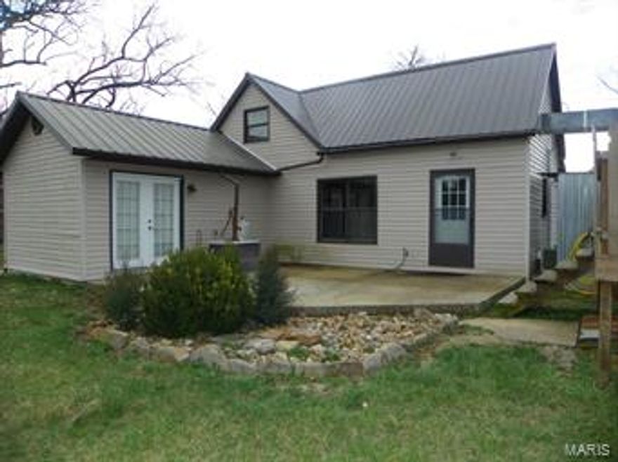 Do you want a little acreage?  Need some space from the neighbors?  Take a look at this 3 Bedroom 1 Bathroom home on 10.02 acres!  This farm style house has been very well kept!  New floors throughout house!  Kitchens has been updated!  Metal Roof!!  The outside has so many perks!  Patio off the Master Bedroom!!!  Deck with above ground pool!!  Storm Shelter!  Chicken Coup!  2 outbuildings!  Detached garage with storage area/shop area!!  Cross fencing!!  POND!!!  All this and its at the end of the road!  Don't miss out come and see this home today!!