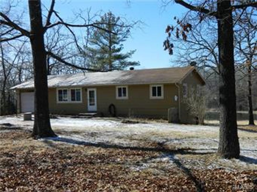 VERY AFFORDABLE COUNTRY HOME!  Nice 3-bedroom ranch-style home just north of Saint James. On just under 3-surveyed acres with stocked lake. Private setting with large yard and lots of trees and wooded area. Home has many updates and includes a covered walkout deck with view of lake. Full lower level walks out to covered patio. Also an attached garage. Don't miss your chance to live in the country at this very nice price!