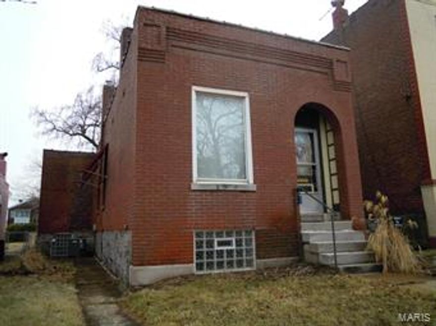 So Much potential with this home!  Great Location - You can walk to shopping, the library, restaurants!  Close to the Park! Very large eat-in kitchen was updated a few years ago and has a fabulous newer gas stove. Original wood floors in Living and Dining Rooms with arched doorway between the rooms. Updated Thermal Windows. Ceiling Fans. Bedroom has huge closet. Unfinished walk out lower level. Newer hvac system and water heater. Oversized 2 car garage (only one bay has a door) opens to back alley. Fenced yard.  AS IS sale.  Use Special Sales Contract.