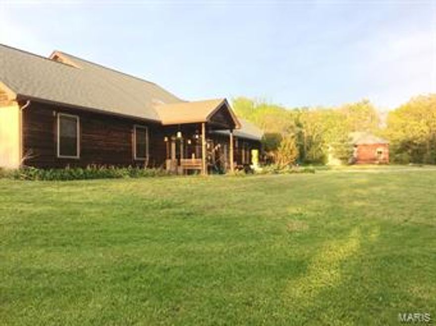 Captivating opportunity!  68 +/- acres with gentle rolling hills.  Great horse property, mini farm or beautiful home with lots of privacy.  Impeccable cedar home, 60 x 40 barn with water outside and electric inside, second small house currently used for storage and small pond.  Home is an energy efficient partial berm home.  Large, open great room with lots of natural sunlight, 2 story vaulted ceiling and amazing views.  Lovely dining room off great room opens to large kitchen boasting a big center island, convenient pantry and lots of attractive cabinets and counter space. Main floor family room for more living space.  In the upper level you'll find a lovely loft overlooking the great room and the large master bedroom suite.  Three more big main floor bedrooms and another full bathroom.  Convenient main floor laundry room.  Great attic for added storage.  Plus! newer septic, all insulated windows & lots of square footage.  Nice rear deck.  Attached 3 car garage.  All this & much more!