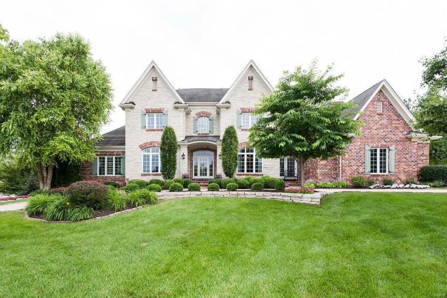 Grand brick & stone manse located in prestigious Greystone. 1.5 story on private lushly landscaped corner lot with in-ground pool. Enjoy Schierholz quality and design: dramatic tall ceilings, 4 extra large bedrooms on second floor plus main floor master suite, paneled office, extensive millwork with trayed and vaulted ceilings throughout, wood floors, French doors and so much more. Gourmet kitchen & breakfast room surrounded by tall arched windows – including Viking range, Sub-Zero refrigerator, granite countertops, cozy window seat and an adjoining two-story hearth room with impressive fireplace. Elegant dining & living rooms with floor to ceiling windows and limestone fireplace. High pour finished walk out lower level for family fun with cherry bar, cedar & wine closets, billiard area, mirrored fitness room and full bath. Low maintenance deck and private pool patio complete the resort-style feel of this elegant and family-friendly home. Experience the luxury you deserve!