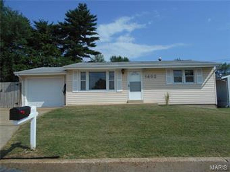 This home was rehabbed in 2016. New kitchen with tile flooring, new kitchen cabinets, stainless gas stove, microwave and dishwasher. Granite counter tops. The main bath is all tile with new fixtures, vanity, tub and shower. Refinished hardwoods in the living room and both bedrooms. There are  vinyl windows and some ceiling fans. Painted in neutral colors. An additional room is in the lower level, also a half bath and a separate shower. New electric hot water heater in 2016 and a 100 amp service panel added.  The Garage is a lengthy 1-car with an additional 275 foot storage area/man cave. The driveway is a double-wide with an extra storage concrete pad alongside the garage, behind the 6 ft wooden fence. There is a large level fenced yard, a shed and another fenced area for a pet or garden. A 1-year Home Warranty is also being provided.