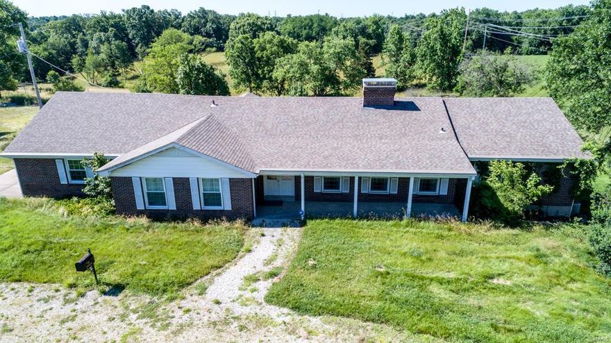 Amazing opportunity. Own your own private estate. Tons of possibilities. There are 3 homes on the approximate 33 acres! Build your dream home w/your own builder and plan. Gorgeous 48 x 60 workshop/hobby area in pristine condition. There are also multiple stables & barns. Plenty of room for horses w/the possibility of multiple pastures. Ranch, brick home includes 5 bedrooms, 3 full baths, walk out lower level and offers endless possibilities. Includes 5 tax IDs - 21V130026, 21W340109, 21W340091, 21W620021, 21W340062.