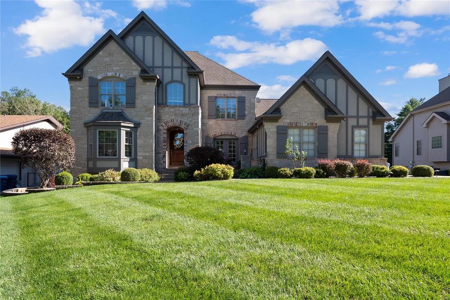 Gorgeous Custom 1.5 story home in Ladue Schools! Five bedrooms, 4 full, 2 half baths, w/open floor plan. Home office w/ bay window & built-in bookcases. Formal dining room w/ French doors. Huge great room, WB fireplace, built-in bookcases & floor-to-ceiling French doors featuring plantation shutters. Entertain with ease in the cooks’ kitchen: Large ctr island w/ built-in wine racks, granite counters, SS appliances incl 5-burner gas range, triple sink, Butler’s pantry. Main floor master suite w/ walk-in closet, tray ceiling, and bay window. The UL offers 3 bedrooms, 2 full baths, and an elevated bonus room perfect for a playroom or teen’s hangout. The finished LL includes a home theater with a wet bar!  5th bedroom w/ ensuite bath, wine closet, extra storage, and more space to enjoy in the rec room. The outside will not disappoint, offering a stunning saltwater pool w/ fountains, large deck w/ hot tub, and charming pergola all backing to a private pond. Close to shopping and highways.