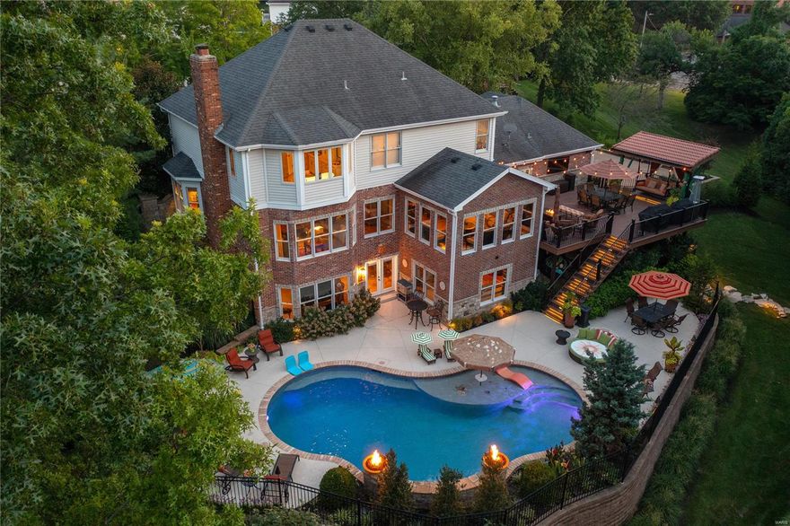 Prepare to Fall In Love with this Designer home FULL of Luxury Updates.  RESORT-like setting surrounded by lush landscaping & One-Of-A-Kind Pool Oasis.  New Custom Front Door invites you into the Bright 2-story entry flowing into the charming DR & LR feat. Brazilian Tiger Wood floors. Expansive Grt Rm offers custom built-ins, gas FP & Bay all overlooking the private grounds. Spacious Updated Kitchen w/ granite counters/custom cabinets /newer Jenn-Air appliances/Skylight/Breakfast rm, & adjoining Sunroom opening to Lrg newer deck for year round entertaining. Convenient main flr laundry/ second half bath & custom designed 3-car garage. Upstairs feat. Lrg Primary Ste w/ his/her closets & Updated Lux bth w/ double sinks, shower, cast iron tub, & heated flr/towel rack. 3 add. Bedrm's & stunning full hall bth w/ double sinks complete the upstairs. Fabulous Fin Walk-out LL is Fully Loaded w/  FR/ Rec Rm/ Bar/Wine Cellar & Lrg 5th Bdrm & Full bath for pool or guests.  Perfect for Entertaining. Additional Rooms: Sun Room, Wine Cellar