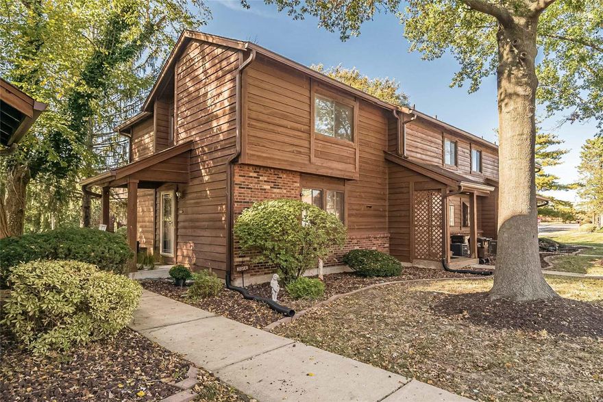 Wonderful ground-floor END unit with only two steps in.  Updated and pristine 2 level townhouse style condo with a full finished basement with hobby/workshop area.  Updated kitchen with custom cabinetry and Corian countertop combine with the dining room atop the wood plank flooring are the perfect size for the home. On the main floor is a beautiful electric fireplace cabinet and mantle that really makes the room.  Against one wall of the living room a wall of mirror that gives a sense of infinite size.  A nice size deck and wood arbor off the living room for sitting out and letting in more light. The carpeting on the steps and in the lower level is BRAND NEW and has given so much more space and utility to the lower level.  There are two assigned parking spaces directly in front of the building and just 20ft away. Additional Rooms: Workshop/Hobby Area Location: End Unit