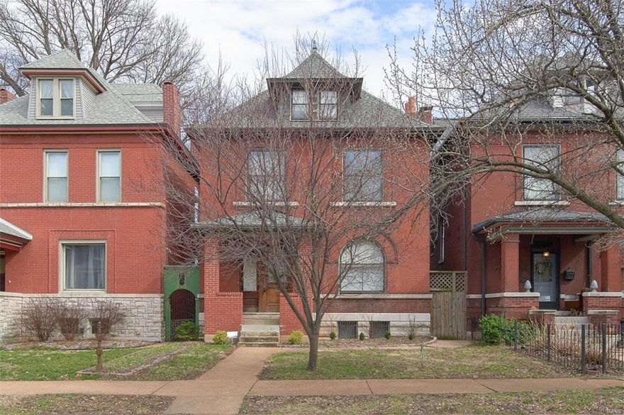 Tower Grove East living at its best. This 5 bed, 2 Bath Victorian has it all. Featuring  an entry hall fireplace  with beautiful oak woodwork and an original staircase with stained  glass windows. The kitchen is loaded with newer stainless appliances, ceramic tile flooring, custom cherry cabinets w/ granite counter tops, pantry and large center island opening to the dining with a full bath adjacent. Original pocket doors throughout the home. 2nd floor holds 3 large bedrooms walk in closet and a large bath with double vanity, tub and separate shower. 2nd floor bath.  3rd floor holds 2 more bedrooms with ample closet space. Located just moments away from all major highways and amenities and shops located off of Grand Blvd.