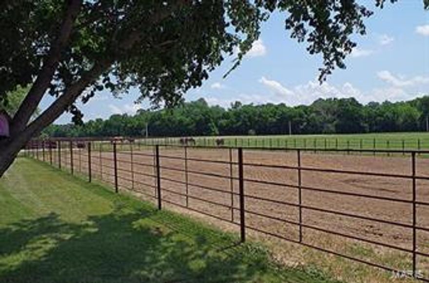 This 21-acre property is fenced and cross fenced into eight separate pastures with automatic waterers.  This “Pocket Ranch” is set up for the horse enthusiast with a Five Stall Horse Barn with runs, heated/cooled tack room/saddle shop. Adjacent to the barn is a 70X150 Riding Arena with continuous pipe fencing.  Additional buildings on property include a Cattle Barn with covered working facilities, four enclosed pens and three runs all with continuous pipe fencing, large shop with two overhead doors, partially concrete with loft storage and a large open front machine shed.  Beautiful views of the rolling countryside can be seen while sitting on the covered front porch of the Ranch Home.  This 1680 sq. ft. 3 Bedroom/2 Bath residence features an eat-in kitchen with oak cabinets and can lighting, Master Bedroom Suite with walk-in closet, Main Floor Laundry and a maintenance free, vinyl exterior.  This property has been tailor made for the Horse or Cattle Rancher.