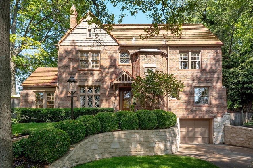 Stunning Tudor in prime Moorlands location! You will instantly be wowed by the unique charm of this home's architectural details. LR w/gas FP & magnificent mantle, beamed ceiling, & stained glass windows make it one of a kind! Leading off the LR is a private office w/ built-ins & doors out to the backyard. The DR w/ exquisite moldings overlooks the LR w/gorgeous archways. The home also boasts a beautiful updated kitchen, breakfast rm, powder rm & an expansive & impressive FR w/wood-burning FP, coffered ceiling, & built-ins. The FR also has breathtaking floor-to-ceiling arched windows & walks out to the private terrace. The 2nd floor includes a primary BR en-suite, 2 additional BRs, updated 2nd full bath & laundry rm. The 3rd story is a large open & light-filled rec room w/ endless possibilities. The parklike backyard is serene w/ private deck & patio. Located just steps away from award-winning Glenridge Elementary, Wydown Middle School, & amazing shops & restaurants of Clayton.