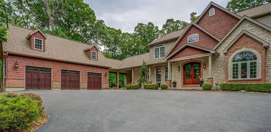 Privacy& tranquility-Spectacular 1.5 stry custom home in Wildwood! Situated on a private wooded 3.09ac lot w/just over 6,651sqft of living space enhanced w/Italian travertine entry, job-finished wood flrs & natural stone accents thru-out. Step thru the wide porch entrance into a 2stry foyer, 10’ ceilings w/8’ interior doors,study w/French drs,elegant dining rm & stunning great rm w/stone FP &wetbar. Chef’s kitchen w/beamed ceiling,hand crafted island &stone counters is adjoined by a light filled brkfst rm & hearth rm w/stone FP & French doors leading to both the back patio & breezeway.Master is an appealing retreat w/large window, see-thru FP, 2 custom closets & luxury bath. Beautiful staircase w/metal accents leads to 3 generous sized bdrms, 1 w/an en-suite + bonus rm. WO LL entertainment space includes a rec rm,TV rm & 5th bdrm w/full bath.Oversized 3car garage (850+ sqft) w/builtin storage & stone counters.Outdr living: breezeway,2 patios & fire pit.High speed internet! Owner/Agent