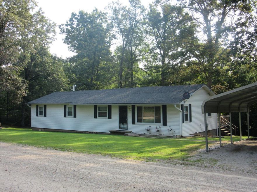 Nice 4 bedroom 1 bath home with large great room and gas log fireplace, new central heat & air, 2 car metal carport and storage building on 3.21 acres (+/-). Minutes from town. Don't miss this one!