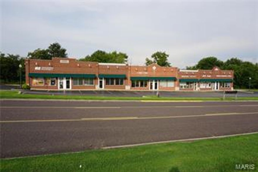 These two commercial buildings sit on a large 2 m/l acre lot and have over 17,000 m/l square feet of retail space!  The asphalt parking lot provides these 12 units with over 90 parking spaces.  They are located in a well established business community close to Walmart and receive great exposure.  This is a great investment property in a great location! Location: City