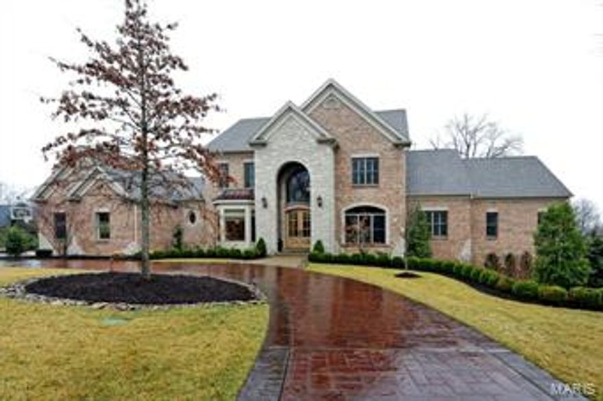 5 Year new Berkley built built home on a private gated street in Ladue schools with outdoor entertaining like you've never seen.  Center stage is the covered lanai w/fireplace overlooking gorgeous pool and professionally landscaped yard. From there step down to the spa or cross the bridge to the pool slide. To the left, a gazebo with BBQ grill, refrigerator and LCD TV.  The 6 Bedroom, 9 bath home offers a great rm, formal dining, butlers pantry, office, state of the art kitchen open to vaulted hearth room with stone fireplace, master suite w/ his/her walk in closets, dressing area w/ built ins and refrigerator, luxury marble bath with dual entry shower, dual vanities and heated floors. A 2nd bedroom suite/nursery & laundry complete the 1st flr. Upstairs; 3 bedroom suites, bonus room & 2nd flr laundry.  Fabulous LL w/ astroturf & padded batting cage, exercise rm, play room, designer bar/kitchen, rec room w/stone fireplace, 6th bedroom suite & bath w/steam room & access to pool.