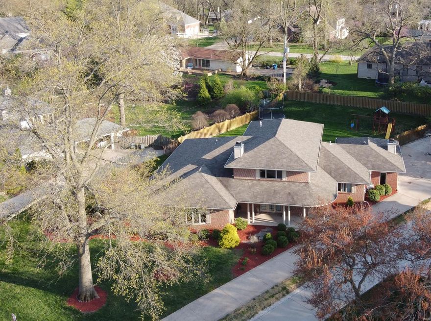 WOW!!! Gorgeous, contemporary, all brick, upscale home. 6000 sf of living area, Open concept floor plan, lots of natural light, built for entertainment. Soaring ceiling, exceptional craftsmanship throughout. Hardwood & tile floors, gas fireplace w/ a stunning stone hearth/wall. Gourmet Kitchen w/ high end appliances, two convection wall ovens, custom cabinets & an oversize Granite chef center island w/ a gas cook top & impressive hood. Breakfast room w/ a wet bar, overlooks a beautiful large, flat, fenced & landscaped back yard. Huge master bedroom w/ a private garden & luxurious master bath featuring double vanities, specious corner jetted tub & a custom shower. Total of 4 bedrooms on the 1st floor (w/3.5 baths) one bedroom w/ a full bath & large loft/office/play space upstairs. Finished basements w/ a “Home Theater” & a 6th bedroom w/ a full bath & lots of storage. Living room & Family room plus large bonus room with a second fireplace. New roof & gutters * Must see virtual tour