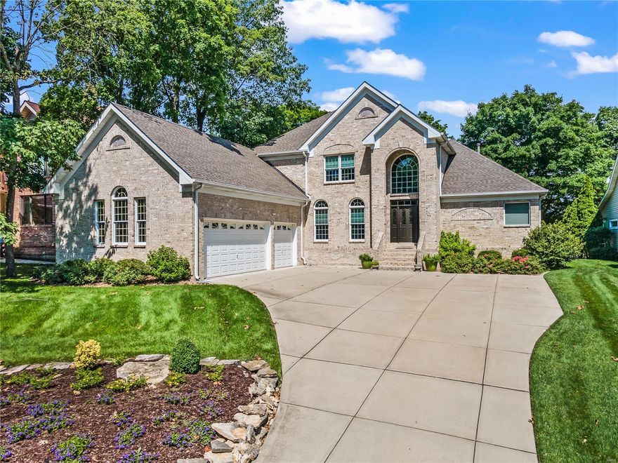 A lifestyle of tranquil lake views and relaxing sunsets is what this waterfront delivers! The owners built a full brick timeless masterpiece w/ a 2 story great room that has a spectacular wall of windows overlooking the lake. The kitchen layout was designed for entertainment & offers a large center island, newer appliances w/ double ovens, Bosch dishwasher, newer custom light fixtures & handmade custom cabinets. Large entertainment spaces include at 53X12 deck, covered patio & boat dock with a lift. The thoughtfully designed master suite also offers lake views opening to the deck! The finished walkout LL has a family rm w/ built-in cabinets, fireplace, wet bar, office, exercise room, full bath and workshop. Other unique features/updates include an actual ship port hole window, decorative handrails, curved 2 story fireplace, new light fixtures, newer roof, newer hot water heater and an oversized 3 car garage.