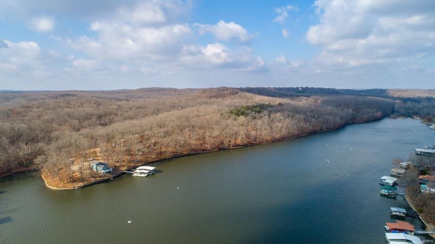 This is an opportunity you do not want to miss! It is truly the last of its kind in the area. This property boasts a move-in ready home along with terrific views of your 110 +/- continuous acres on the banks of the Lake of the Ozarks with over 4,000 feet of shoreline. This opportunity is great for the individual, investor, or developer. It is perfectly located in a qualified opportunity zone in Sunrise Beach, Missouri. The opportunities are major and the area of the property is unique. Here you get a quiet setting while still being close to many popular destinations in the lake area and on the water. Located at the 39 ½ mile marker. Its topography is ideal for just about anything you can imagine, from development to personal enjoyment. From building multiple homes, venturing into a resort-style development, or simply enjoying your very own private retreat, the possibilities here are endless. With much more to learn and see that this property offers schedule your private tour today!