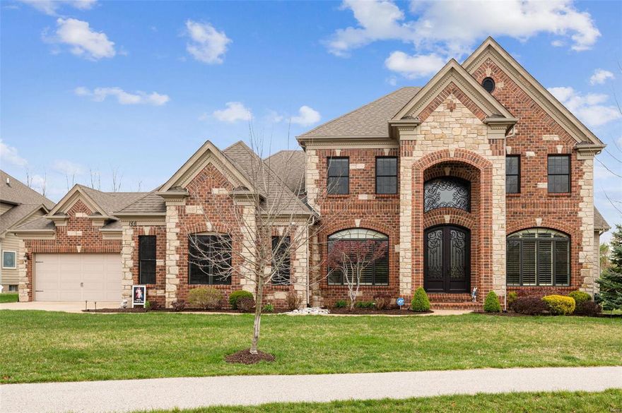 Prepare to fall in love with this 1.5 story showstopper! You’re welcomed inside by a two-story entry foyer and continue to be wowed as you head through to a great room with windows nearly to the ceiling, gas fireplace, & built-ins. The beautiful kitchen is the heart of the home and has high-end appliances, granite countertops, large center island, & is open to the bright breakfast room & cozy hearth room. The separate dining room offers a place to host more formal meals. Enjoy warm weather al fresco dining and cool evenings around the fire outside on the gorgeous patio. The main floor primary bedroom offers a luxury ensuite with a separate shower, two vanities, and two walk-in closets. Upstairs you’ll find 3 additional bedrooms, 2 which share a jack and jill bathroom and a 3rd with its own full bath. The finished lower level has a 5th bedroom, full bath, large rec room with wet bar, & an additional flex space for whatever use you can dream up. A 4-car garage is the icing on the cake!