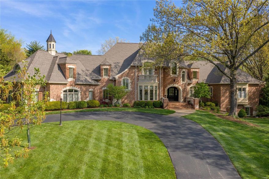 Exclusive Ladue offering sitting on almost 2 acres. Almost 8,000 square feet on the main 2 floors. The perfect balance of traditional & modern updates. Stunning hardwoods & soaring ceilings throughout main floor. Gourmet Kitchen has everything you need w/ center island, custom finishes & adjoining breakfast & hearth rm. Bright & Airy sunroom off kitchen. Breathtaking great rm w/ window wall & wet bar. Home flooded w/ natural light. Expansive Owner's Suite on main floor w/ sitting area, fireplace, his/her closets & bathrooms & french doors to patio. Main floor includes 2 separate office areas, 2 laundries & additional baths. Upper-level feat. 3 ensuite BR's + Huge bonus rm w/ half bath for possible 4th ensuite on second flr. LL includes family rm, additional ensuite BR, bar, & wine cellar. This home is in immaculate condition. Exterior includes separate pool area & tremendous amount of green space. Oversized 4 car garage! This home is an entertainer's dream of uncompromising quality. Additional Rooms: Mud Room, Sun Room, Wine Cellar