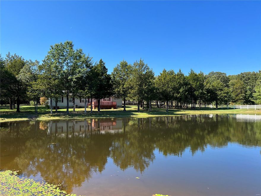 DO NOT miss seeing this amazing property...it has it all! 18 acres mostly wooded, 1 acre stocked pond, 30x56 outbuilding, and a ranch style home with oversized 2 car garage. Plus, it sits in a great location between St. James and Rolla. The home is 1808 sq ft with 3 bedrooms and 2 bathrooms. Large master suite with soaker tub, shower and walk in closet. Separate dining room connects to the living room. Very nice kitchen with lots of cabinet and center island. Kitchen connects to the back deck where you will love spending most of your time, relaxing and enjoying the view of the beautiful pond. If you want a place to tinker and store all your toys, the outbuilding is fantastic. It has a 10' overhead roll-up door with opener, side sliding barn door, concrete floors, electric, and its insulated. We don't have many of these properties for sale. Call today and schedule your showing!