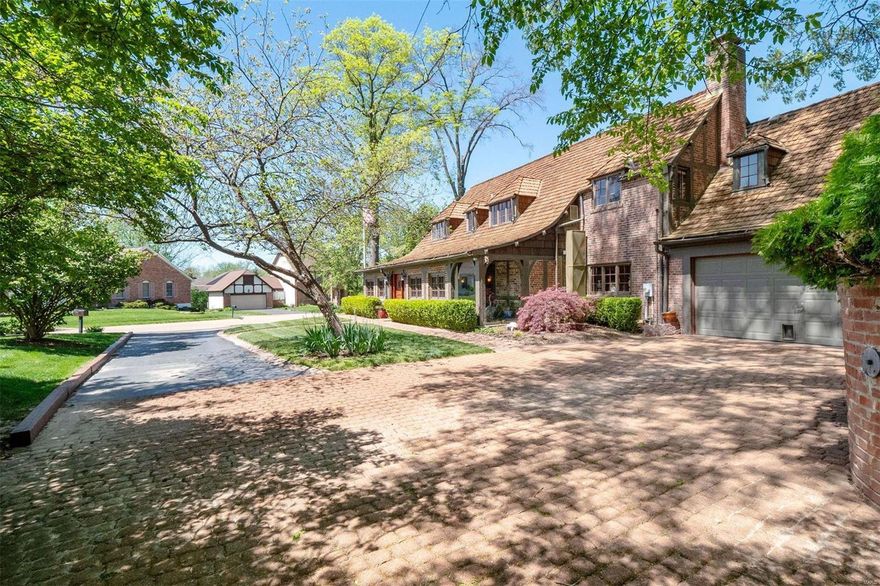 Property sold as is and appraised at asking price or better. Having graced the cover of House Beautiful and Home and Garden magazines, it's no surprise that this English Manor home has set the bar for architecture and style. You've dreamed of a poetic lifetime retreat where all can gather, find peace and evolve into their best selves..It's here! 1st & 2nd floor primary suites allow for all stages of life. Enter a spacious pub room with glass planting nook and jovial bar for parties. Paralleling this entirely is the Great Hall with mammoth fireplace, hand hewn beamed ceiling, space for several conversation areas and formal dining plus direct access to a Country French inspired kitchen and tucked away 2nd floor has incredible views of the English courtyard and former stables. Interior and Courtyard are seamlessly married to enjoy both at the same time. 2nd floor offers 3 bedrooms and an oversized studio. Main level in law suite captivates as a great room or bedroom/full bath & laundry.