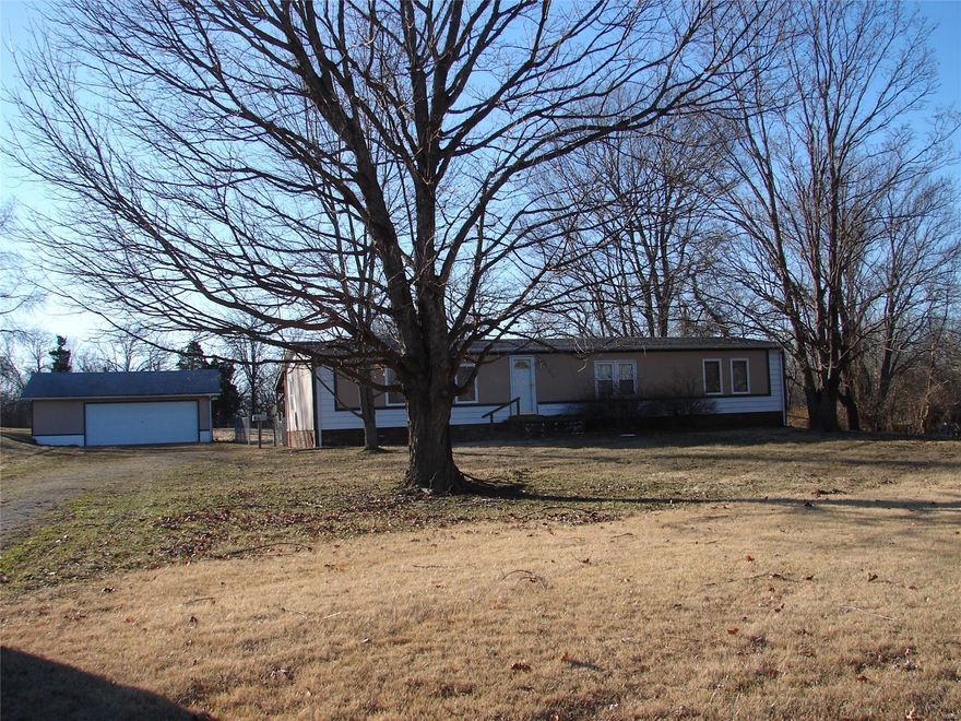 Lots of space for the money! Lot is amazing, level and serene! The house is just waiting for your personal touches or move right in! Home offers 2 living rooms, dry bar, divided bedroom floor plan, open kitchen and living room, master suite with large bathroom and walk in closet. All this in Jefferson R-7 school district. Call today for your showing.