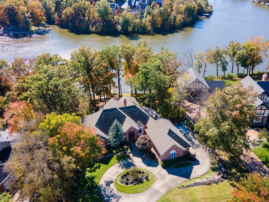 SHOWINGS START 10/18. GORGEOUS Lake St Louis WATERFRONT in NO WAKE COVE. 112 FT FRONTAGE. 2 COVERED BOAT DOCKS W/2 LIFTS FOR SKI & PONTOON. SPRAWLING BRICK RANCH on .76 ACRE w/ PANORAMIC LAKE VIEWS. 5 bedrooms, 4 Baths, 6,000+ sq ft., LG FAMILY ROOM w/DBL Sided Gas FP & VAULTED CEILING Provides BREATHTAKING BEAUTY. KITCHEN Offers QUARTZ COUNTERS Thru-out with DESK, WINE BAR & WET BAR too. SOLID WOOD CABINETRY, Eat-In Breakfast Room & LG Island. SUNROOM HAS GLEAMING WALL OF WINDOWS Accentuating the AMAZING BEAUTY OF THE LAKE! LG Main Floor MASTER 2 W/I Closets, LUXURIOUS BATH, SEP SHOWER & UPDATED DOUBLE VANITIES! Priv Bedroom/Office on Main. WALKOUT LL Boasts HUGE FAMILY Room, WB FP, 2 FULL BATHS & 3 ADD'L BEDROOMS. ENJOY VIEWS OF LAKE FROM LOWER LEVEL. REC Room & GLASS PARTY ROOM w/ WINDOW SURROUND for 12+ Guests. UPDATED: LG CRAFT/LAUNDRY, CEDAR CLOSET. NEW FLOORING, Paint, Blinds & PROF LAND., LIGHTED Path,Terrace, **39' x 25' SIDE-ENTRY 3 CAR GARAGE* Perfect Lot for In-Ground Pool!