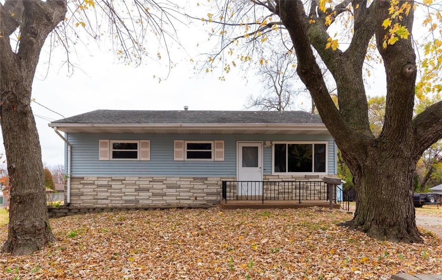 Talk about the perfect place to call home! This adorable, move in ready ranch is waiting for you. When you pull up to this home you will be blown away by the lot size, HUGE fenced in yard, beautiful new flooring, counters, fresh paint and an updated bathroom. The large living room is connect to the dining space, making this open floor plan home perfect for entertaining. Let's not forget about the FINISHED lower level with an extra sleeping space, tons of storage and a retro gas fireplace. Plus, the riding lawn mower, washer and dryer stay which means one less thing a new home owner needs to worry about. Dont miss this cutie!
